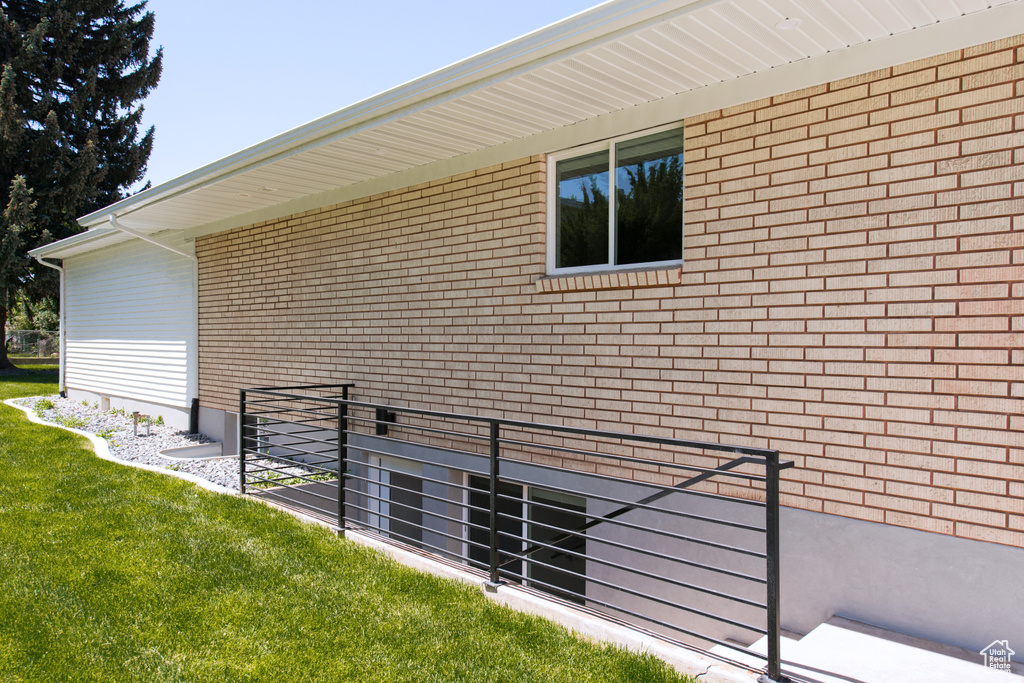 View of side of property with brick siding