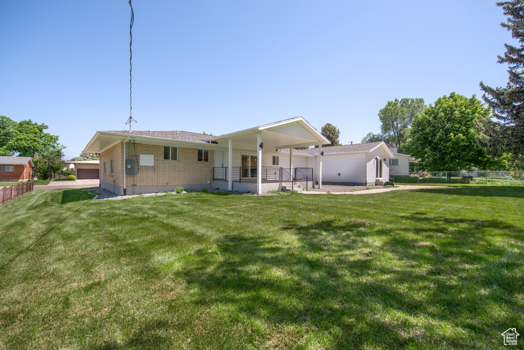 Back of property featuring brick siding and a patio
