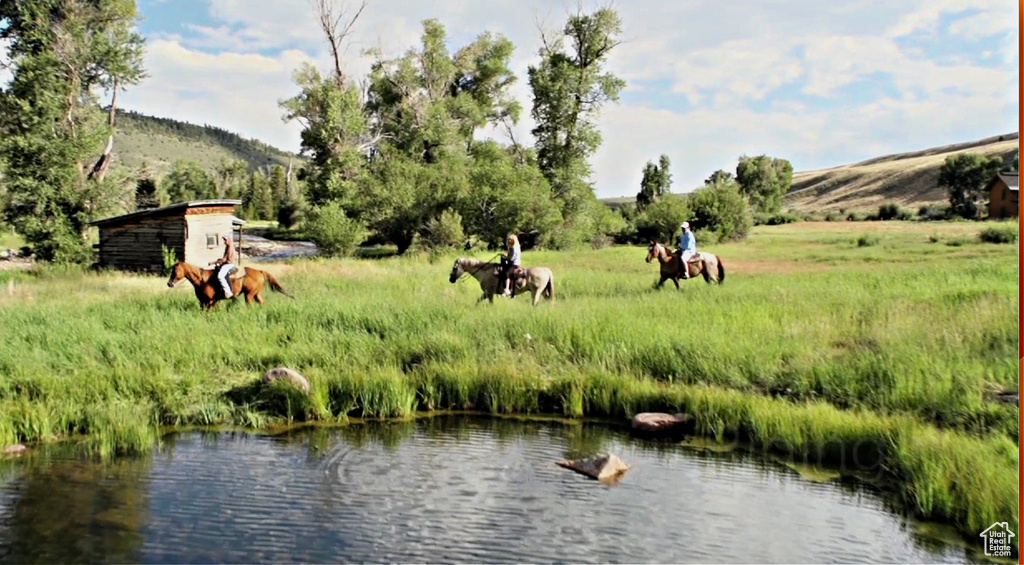 Water view featuring rural landscape and a pastoral area