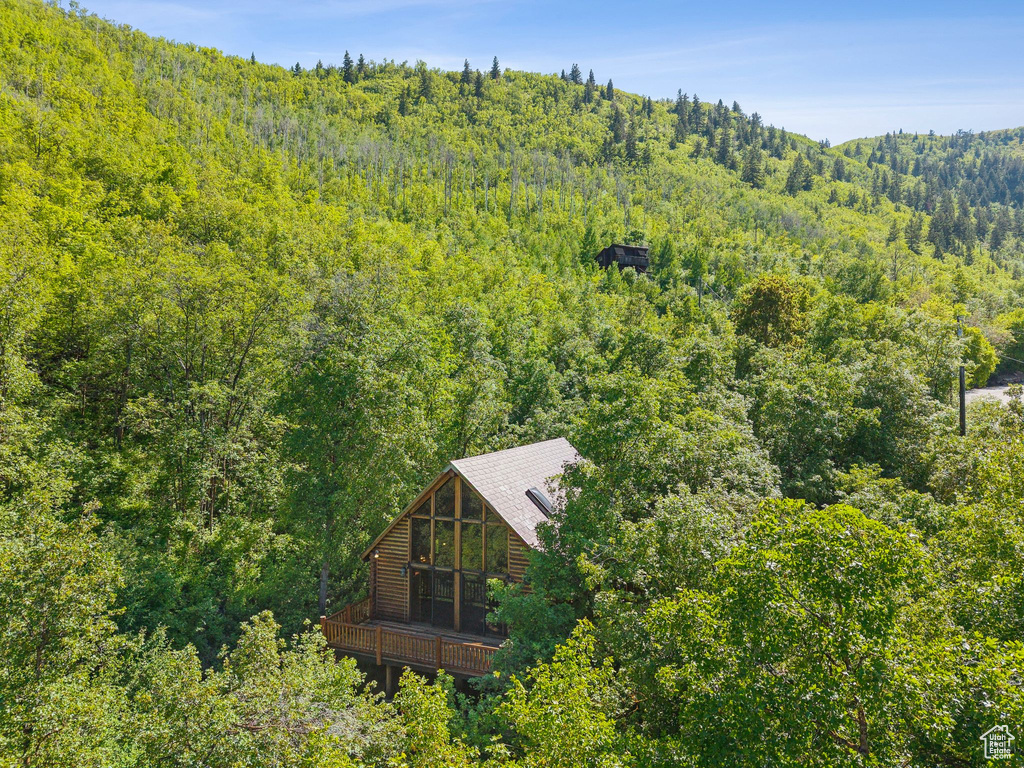 View from above of property with a heavily wooded area