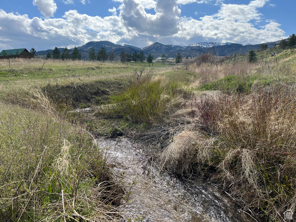 View of mountain backdrop with rural landscape