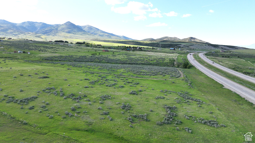 View of mountain backdrop with rural landscape