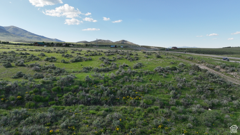 View of mountain backdrop with rural landscape