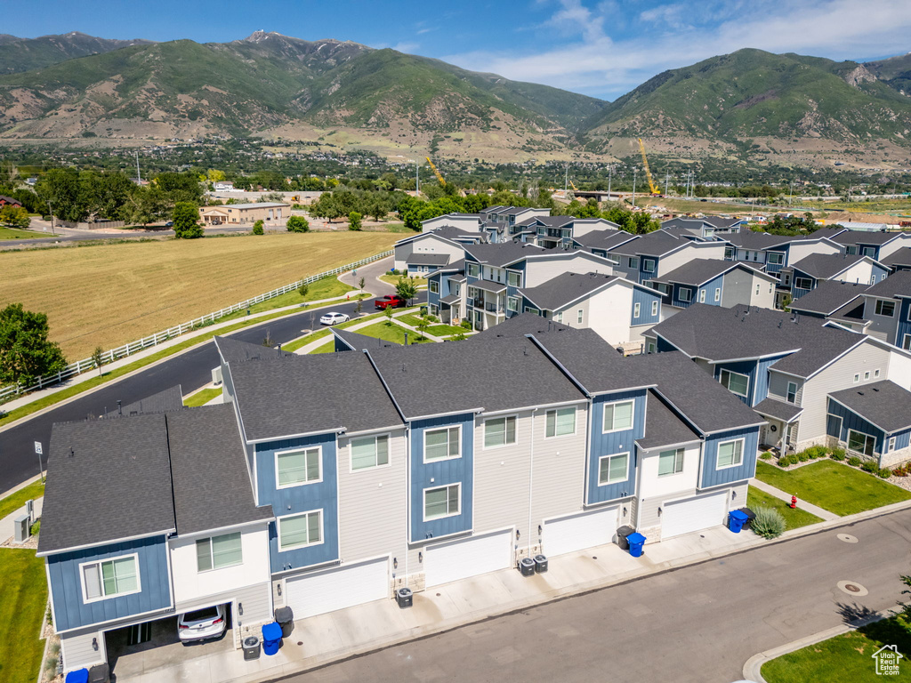 Aerial perspective of suburban area with a mountain backdrop