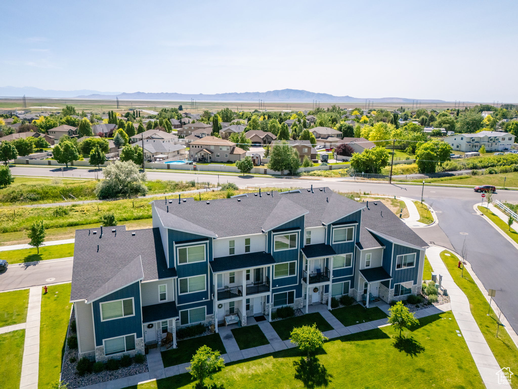 Aerial perspective of suburban area featuring a mountainous background
