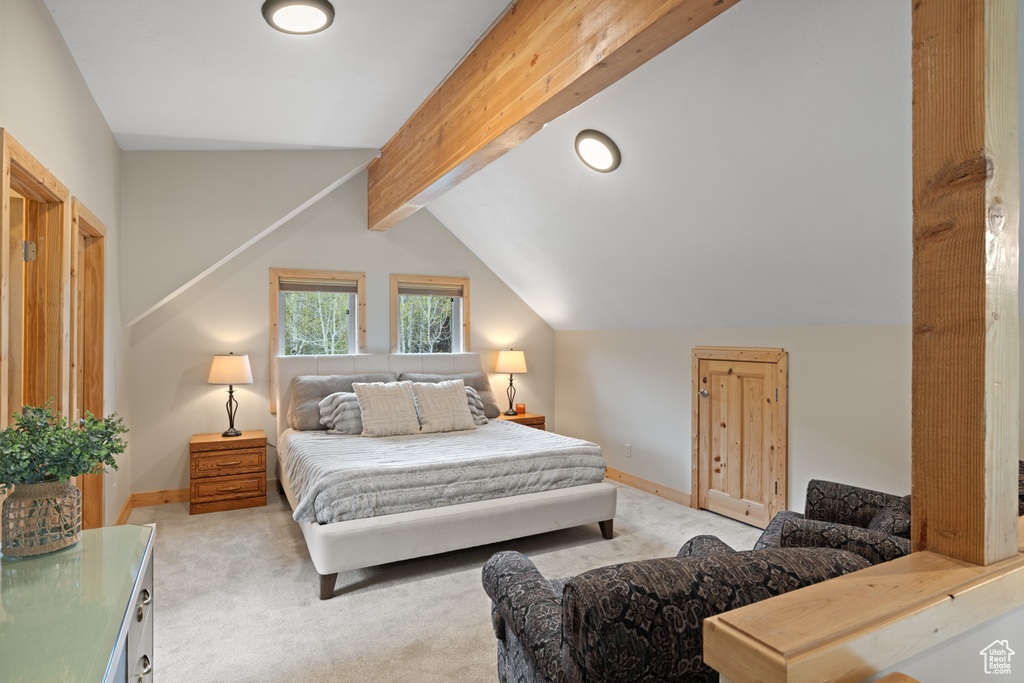 Bedroom featuring light carpet and baseboards