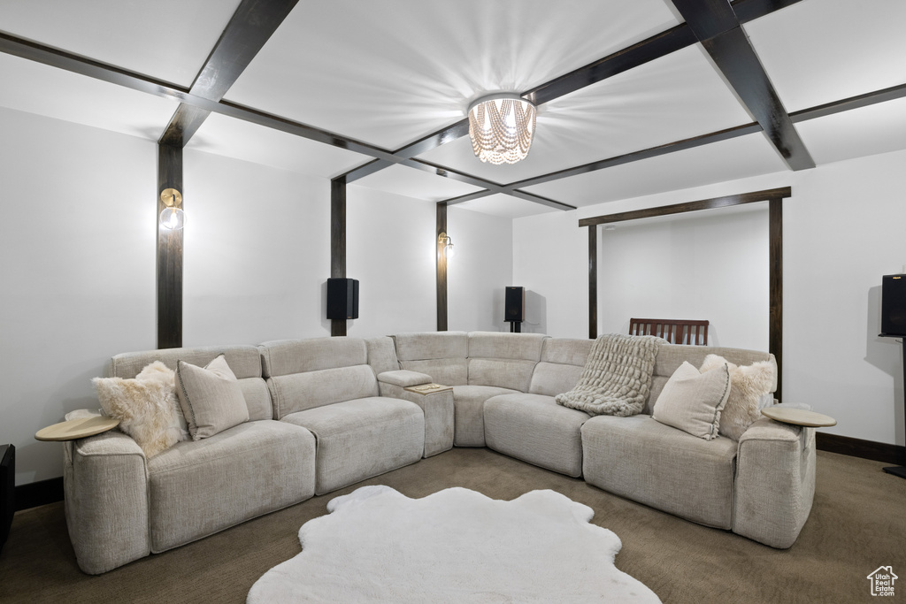 Cinema room featuring carpet floors, baseboards, and coffered ceiling