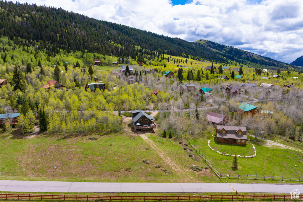 Aerial view of a heavily wooded area and mountains