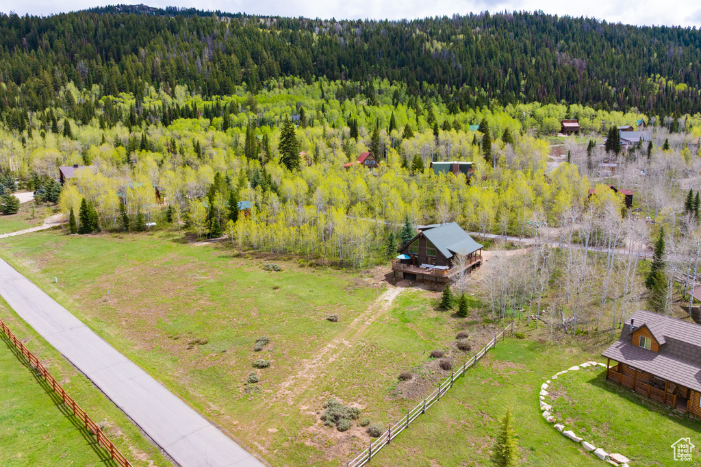 View of subject property featuring a heavily wooded area