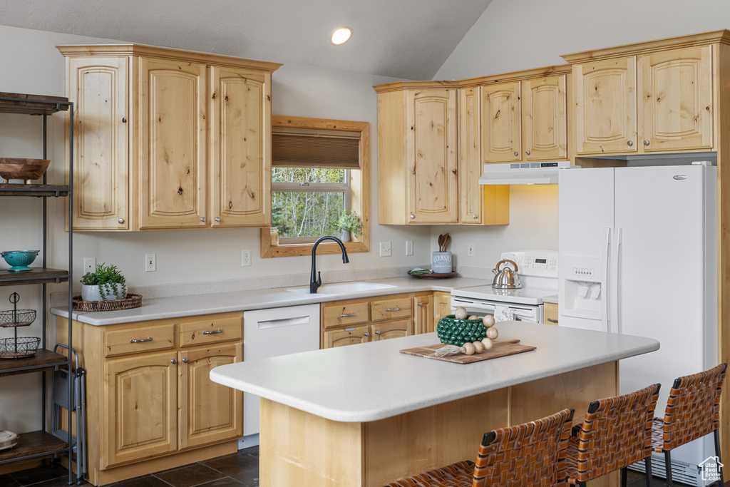 Kitchen featuring white appliances, under cabinet range hood, a sink, open shelves, and light countertops
