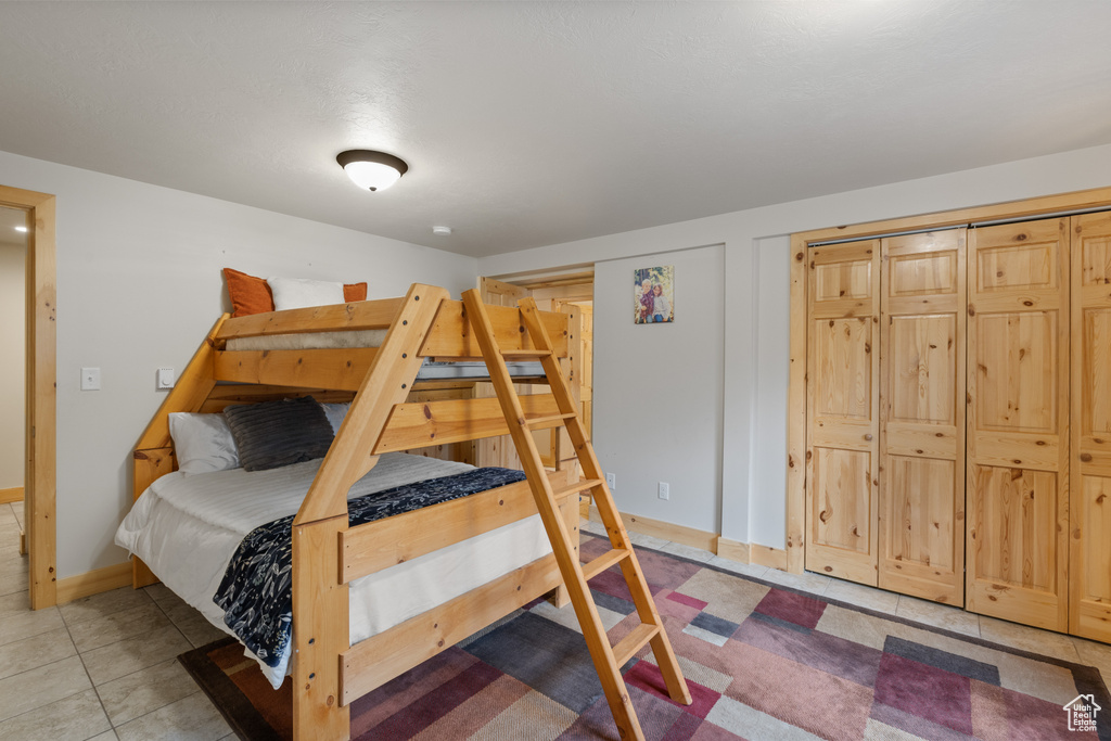 Tiled bedroom with baseboards