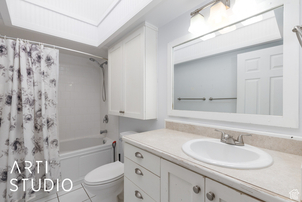 Full bath with vanity, shower / bathtub combination with curtain, and toilet