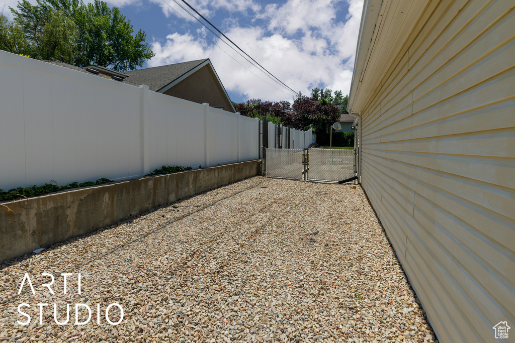 View of yard with a gate