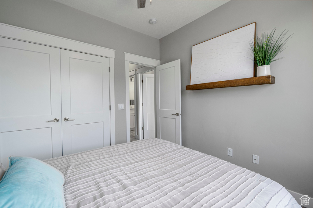 Bedroom featuring a closet and a ceiling fan