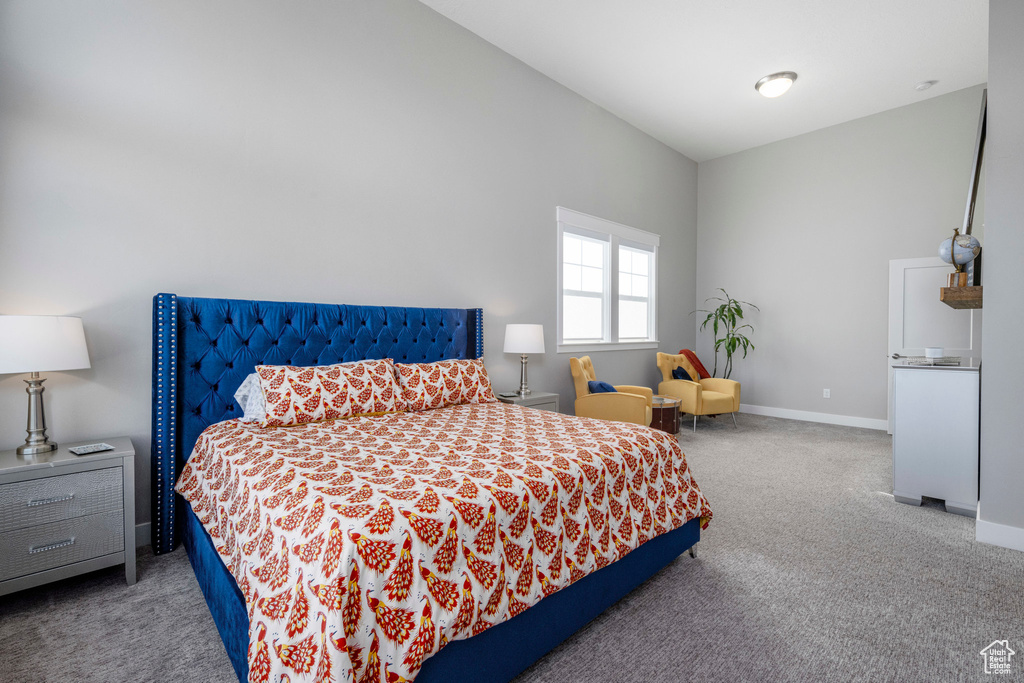 Bedroom with carpet flooring and baseboards
