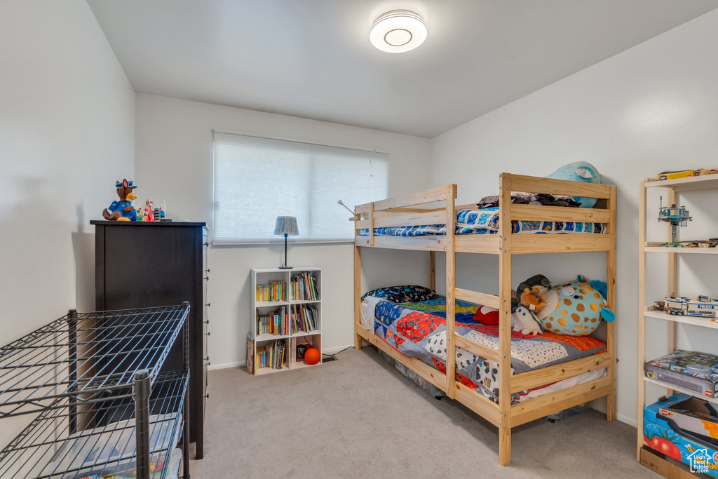 Bedroom with carpet and baseboards