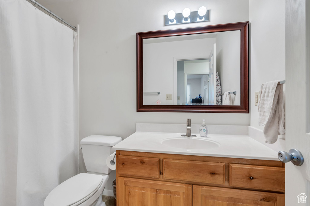 Bathroom featuring vanity and a shower with curtain