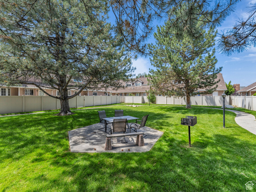View of yard with a patio area and a residential view