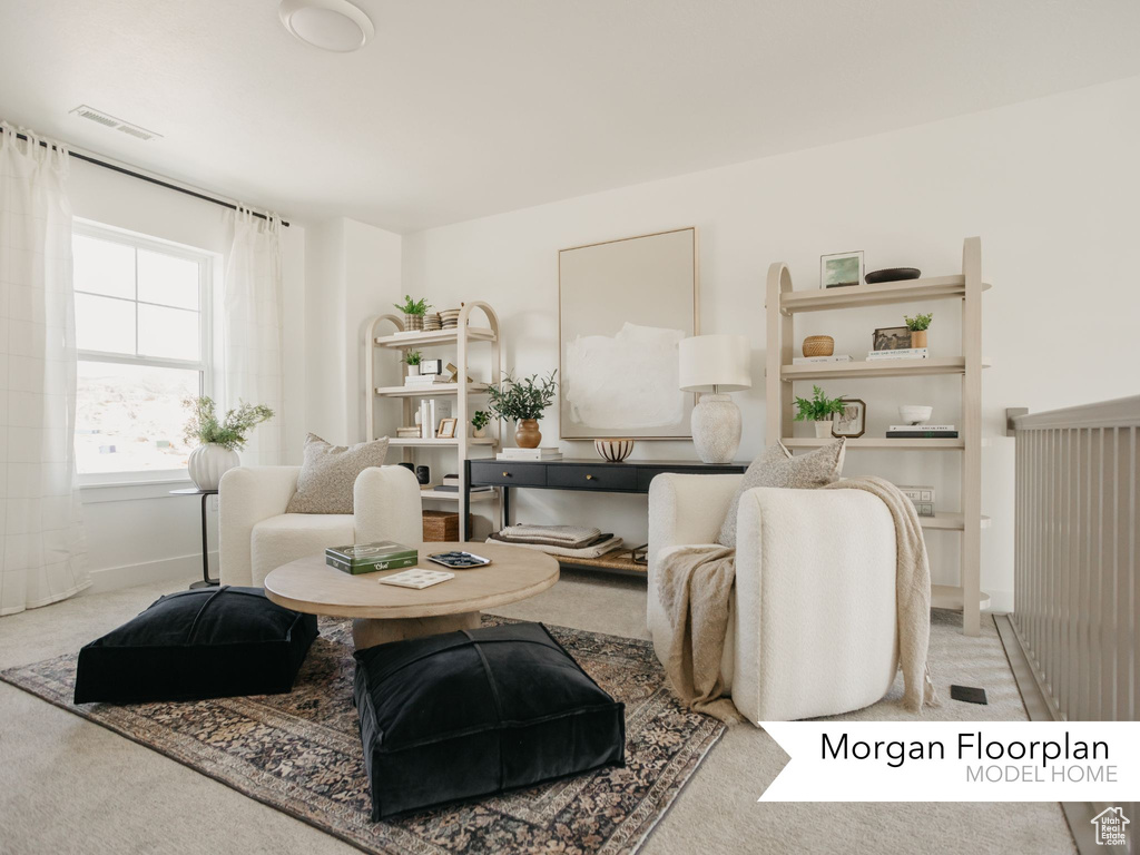 Living room with carpet floors and baseboards