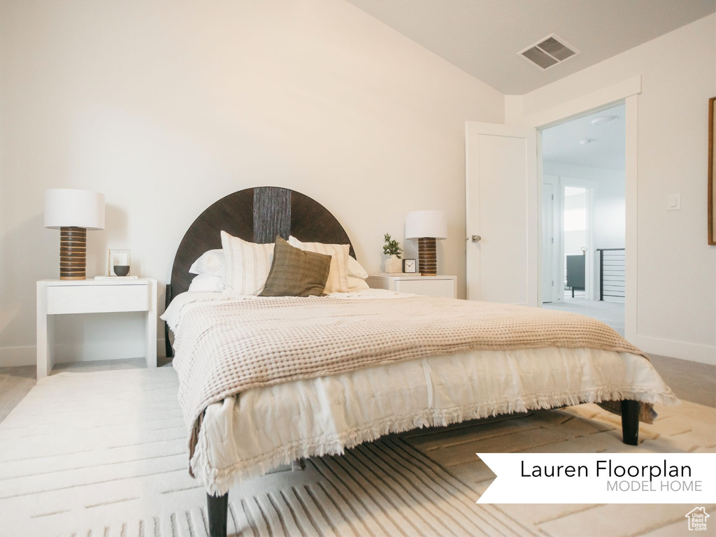 Bedroom with baseboards and lofted ceiling