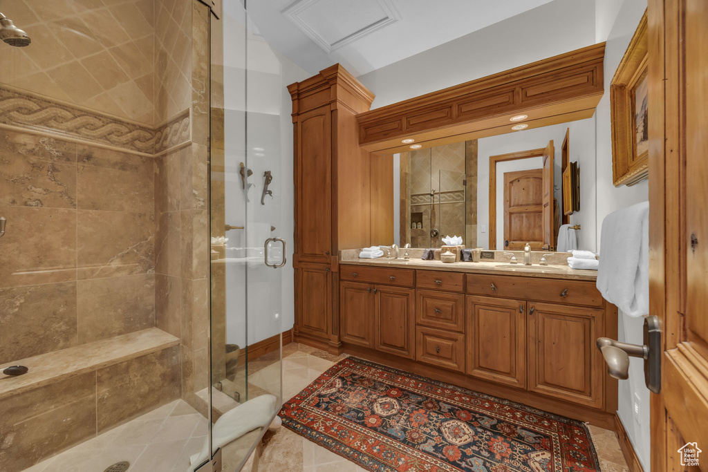 Bathroom with a stall shower and double vanity