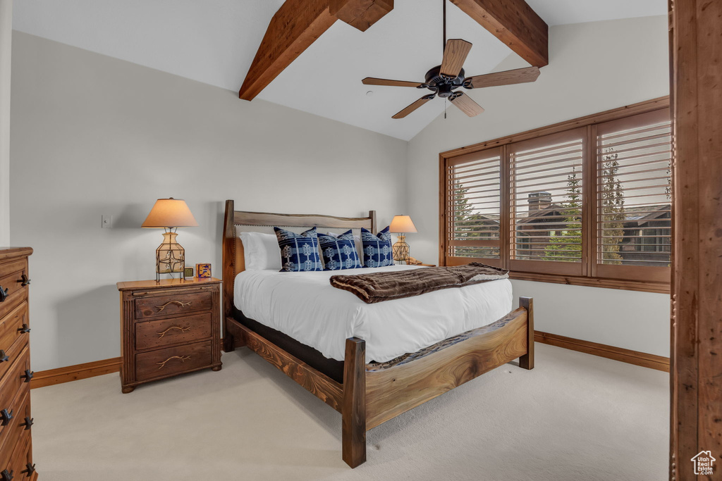 Bedroom featuring baseboards, light carpet, and a ceiling fan