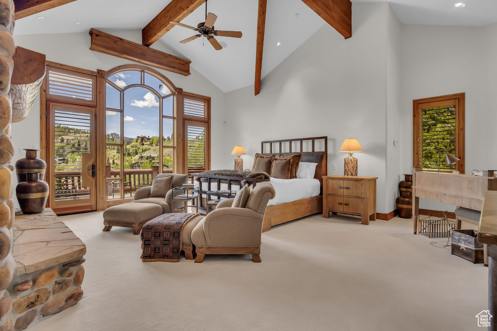 Bedroom with access to outside, carpet floors, beam ceiling, multiple windows, and recessed lighting