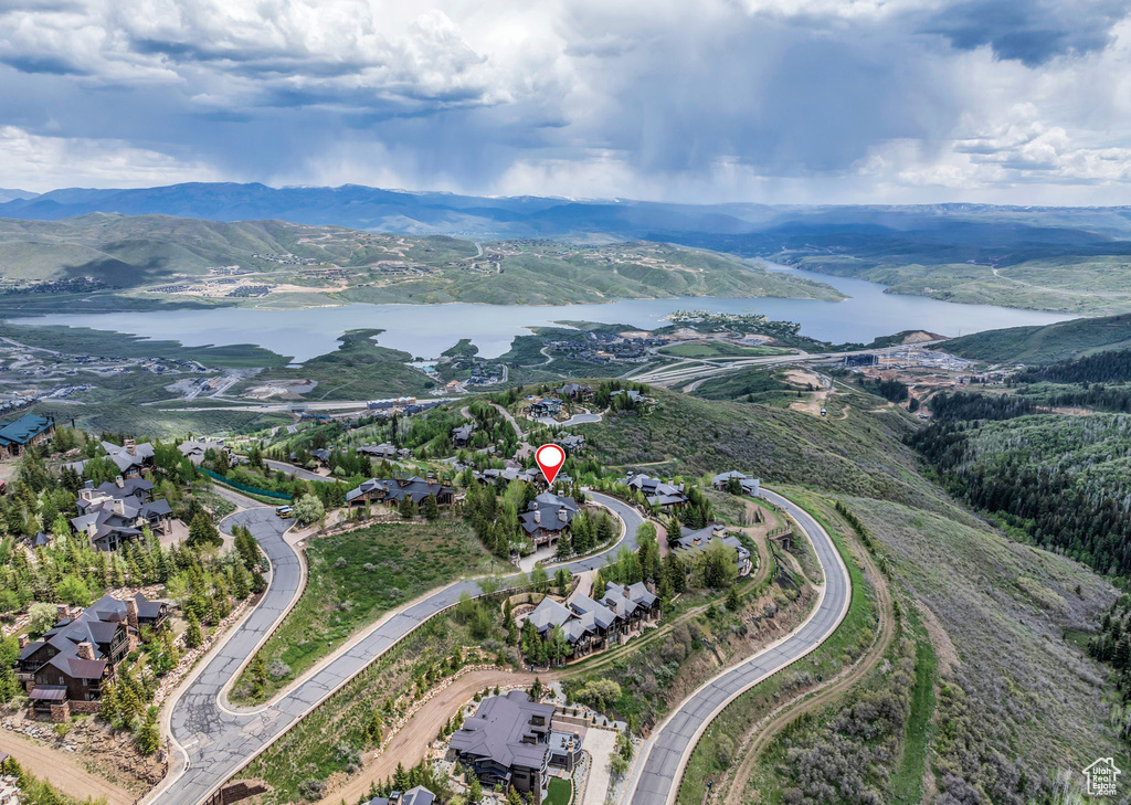 Aerial overview of property\'s location with a water and mountain view