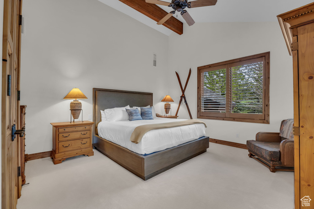 Carpeted bedroom featuring baseboards and a ceiling fan