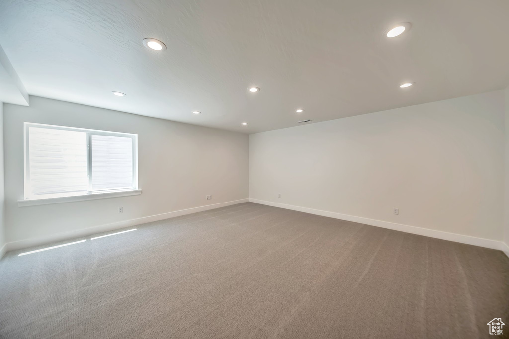 Empty room with recessed lighting, baseboards, and carpet floors