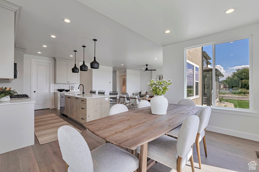 Dining space with recessed lighting, dark wood-style floors, and ceiling fan