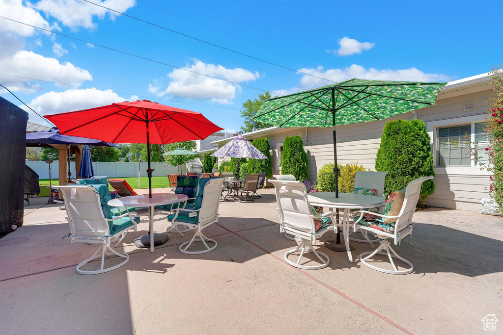 View of patio with outdoor dining area