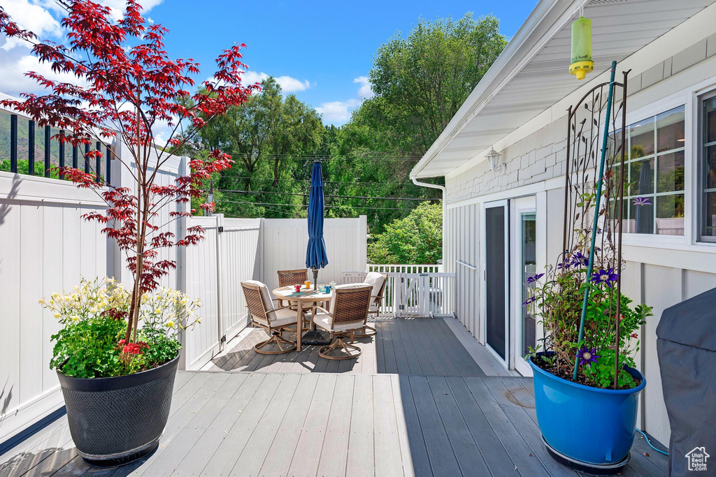Wooden terrace with outdoor dining area