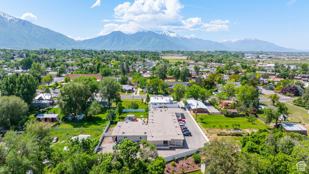 Aerial perspective of suburban area featuring a mountain backdrop
