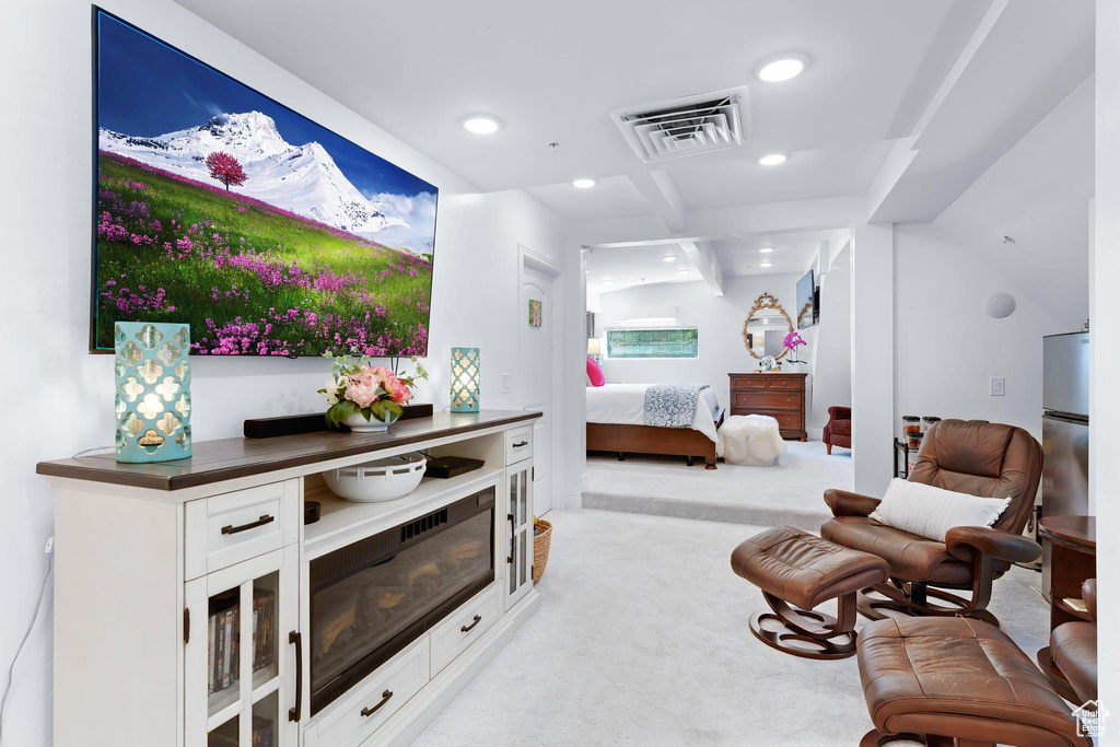 Bedroom with light carpet and recessed lighting