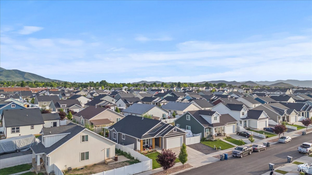Aerial perspective of suburban area featuring a mountainous background