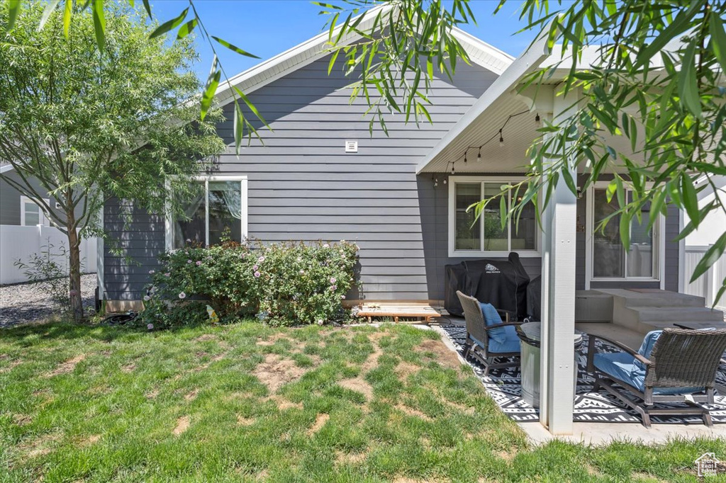 Rear view of house featuring a patio
