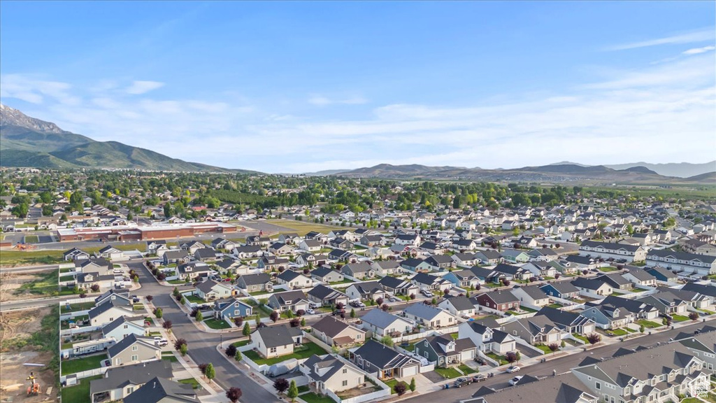 View of property location with mountains and nearby suburban area