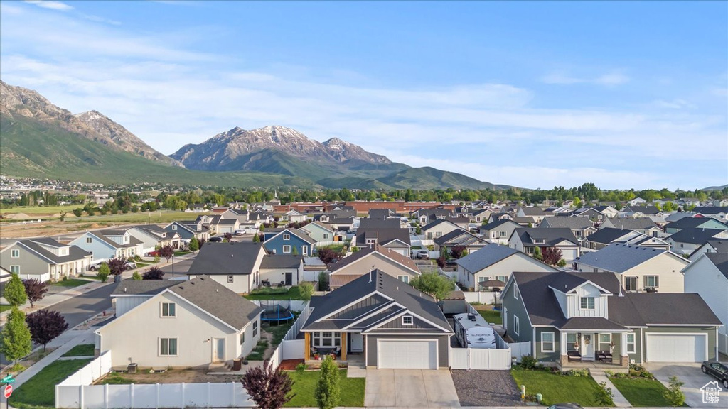 Aerial perspective of suburban area featuring a mountainous background
