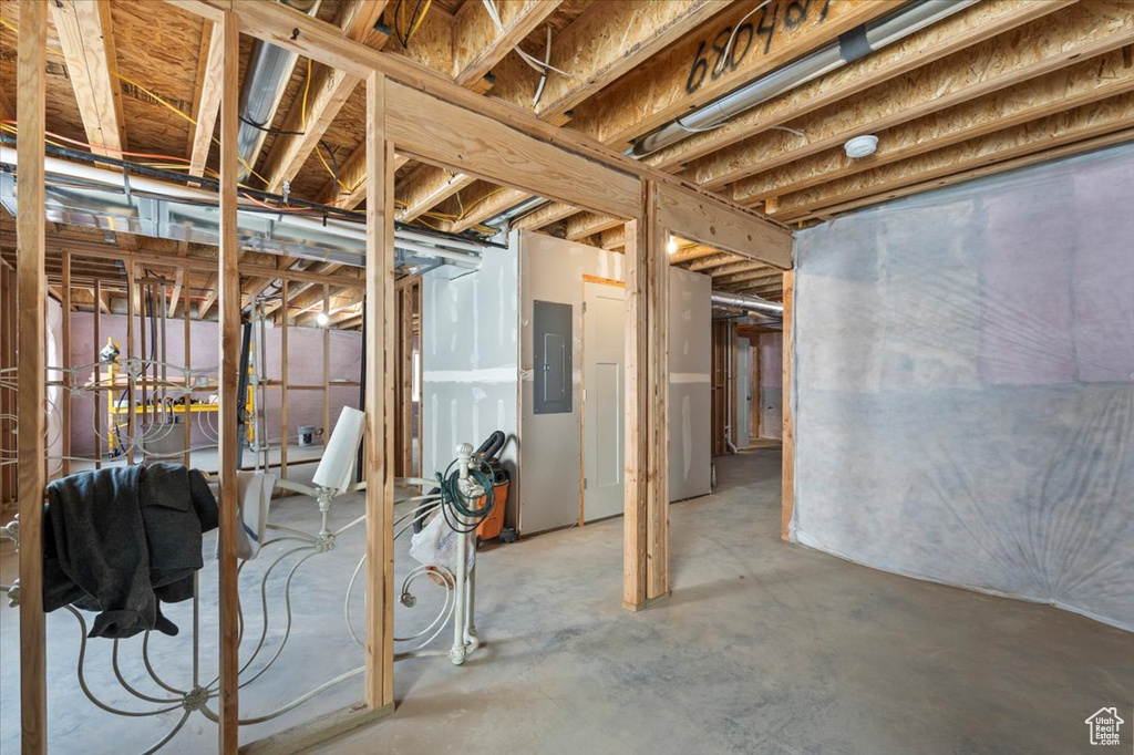 Unfinished basement featuring electric panel