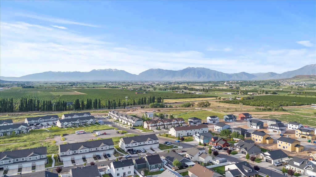 Aerial perspective of suburban area featuring a mountainous background