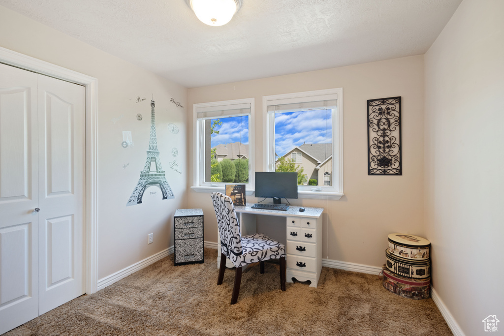 Carpeted office featuring baseboards