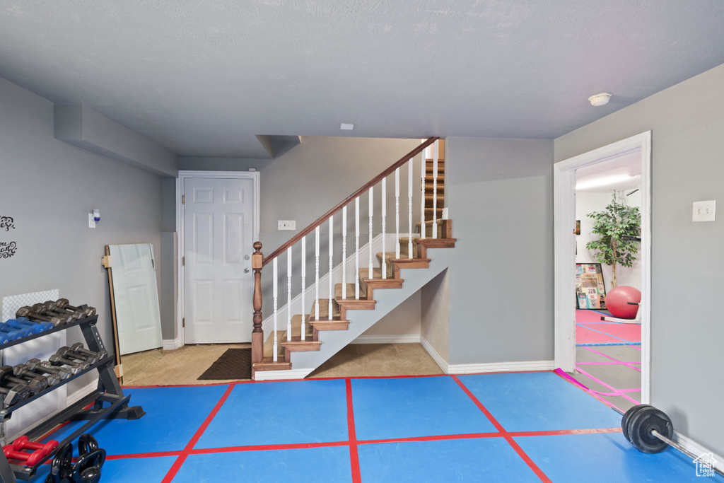 Foyer with stairs and baseboards