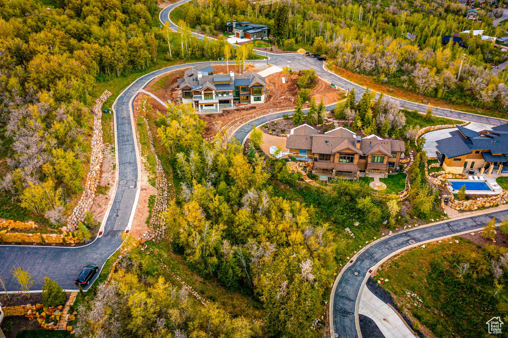 View of property location featuring a forest