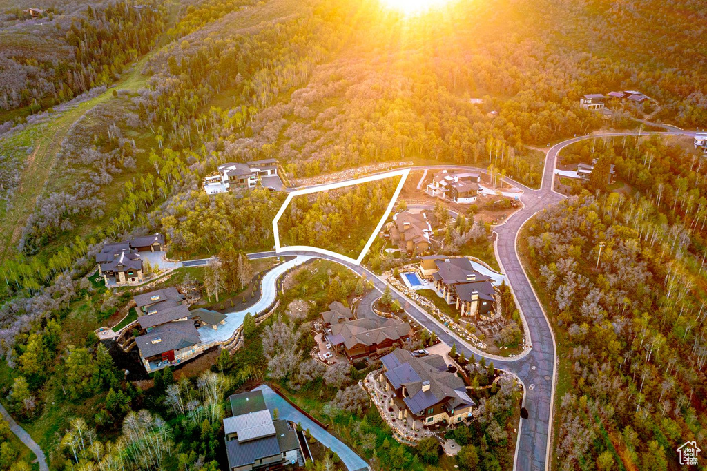 View of property location featuring a heavily wooded area