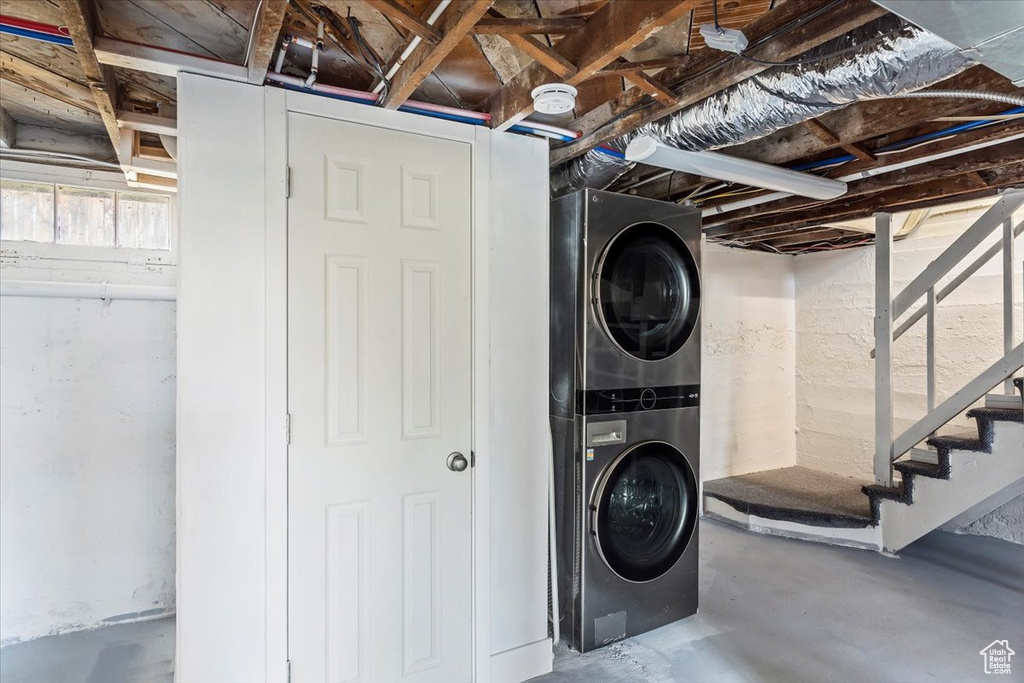 Laundry room featuring stacked washer / dryer