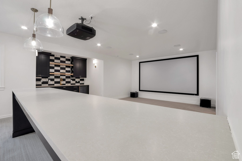 Home theater featuring recessed lighting and baseboards