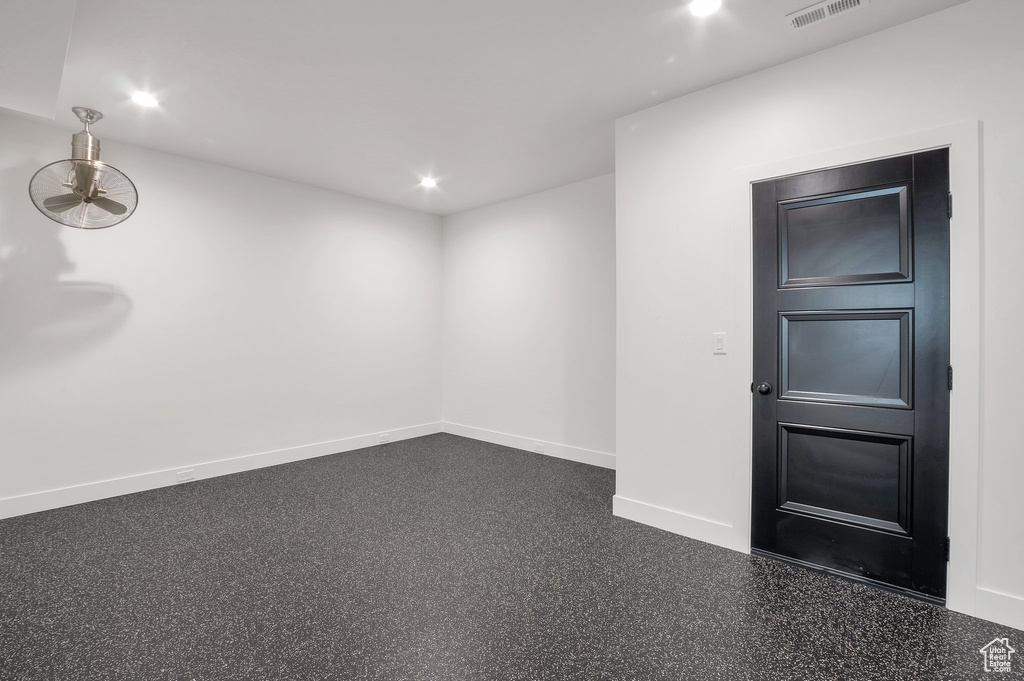 Empty room with recessed lighting, light speckled floor, baseboards, and a ceiling fan
