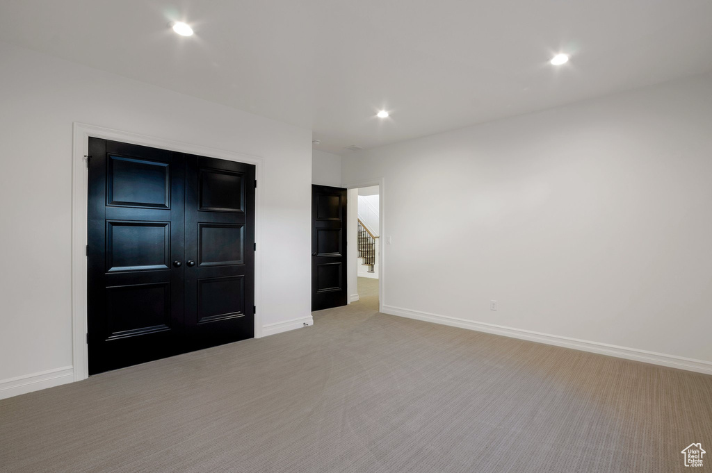 Unfurnished bedroom with baseboards, recessed lighting, and carpet flooring