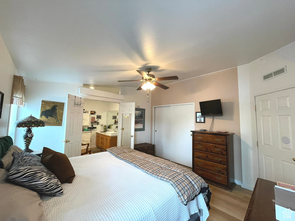 Bedroom with light wood-style flooring and ceiling fan